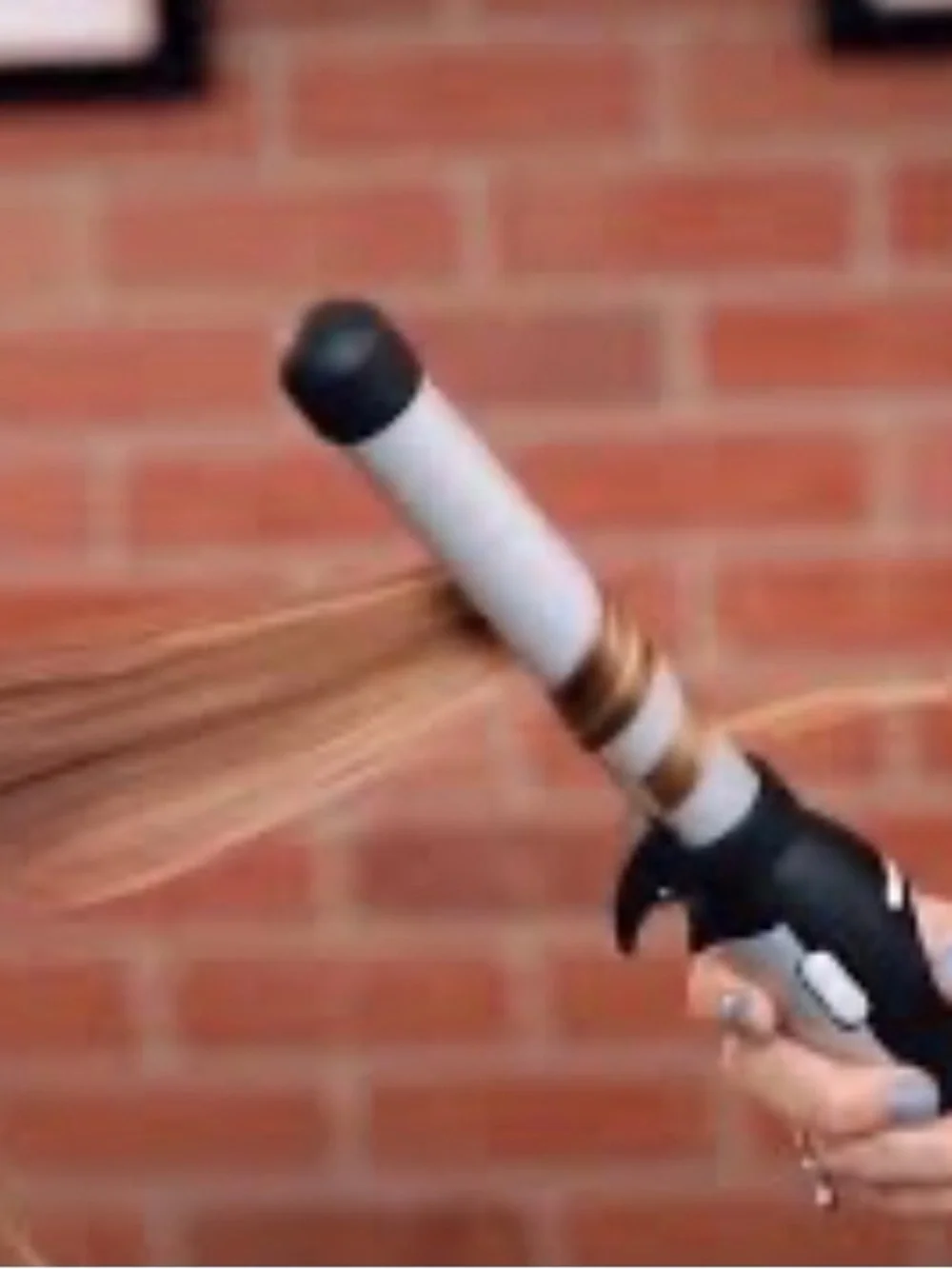 The Beachwaver Co. S1 Curling Wand in Black and Silver